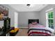 Neutral bedroom featuring natural light, a desk, and a colorful Marvel themed decor at 4332 Bathurst Dr, Charlotte, NC 28227
