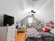 Spacious bonus room bedroom featuring vaulted ceilings, a ceiling fan, and hardwood floors at 4332 Bathurst Dr, Charlotte, NC 28227