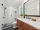 Modern bathroom with tiled shower, wood vanity, and stylish fixtures at 4701 Pineland Pl, Charlotte, NC 28277
