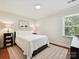 Cozy bedroom with a neutral color scheme, natural light, and hardwood floors at 4701 Pineland Pl, Charlotte, NC 28277