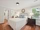 Cozy bedroom features hardwood floors, natural light, and ensuite bathroom at 4701 Pineland Pl, Charlotte, NC 28277