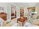 Comfortable living room with French doors, a cozy seating area, and views of the adjoining kitchen at 4701 Pineland Pl, Charlotte, NC 28277