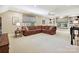 Spacious living room with built-in bookcases and large windows for ample lighting at 4701 Pineland Pl, Charlotte, NC 28277