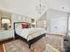 Bright main bedroom with vaulted ceiling, large window, and stylish furnishings at 4701 Pineland Pl, Charlotte, NC 28277