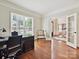 Spacious office with large window, desk, and view to foyer at 4701 Pineland Pl, Charlotte, NC 28277
