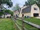 View of home from backyard showing large yard with a fence and mature trees providing privacy at 4905 Montibello Dr, Charlotte, NC 28226