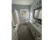 Bathroom featuring a new vanity and a shower/tub with a white shower curtain at 4905 Montibello Dr, Charlotte, NC 28226