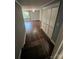 Spacious bedroom with hardwood floors, a window for natural light, and a closet with bi-fold doors at 4905 Montibello Dr, Charlotte, NC 28226
