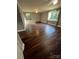 Large bedroom featuring hardwood floors, two windows with natural light, and a ceiling fan at 4905 Montibello Dr, Charlotte, NC 28226