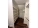 Walk-in closet with multiple shelves and hanging racks for organized storage at 4905 Montibello Dr, Charlotte, NC 28226