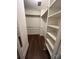 Walk-in closet featuring built-in shelves, a mirror, and hanging racks at 4905 Montibello Dr, Charlotte, NC 28226