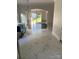 Bright dining room with hardwood floors, elegant chandelier, and a large window overlooking the backyard at 4905 Montibello Dr, Charlotte, NC 28226