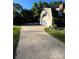 Long driveway leading to a two-car garage, offering ample parking and access to the home at 4905 Montibello Dr, Charlotte, NC 28226