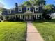 Inviting front facade with lush lawn, showcasing the home's curb appeal and neighborhood charm at 4905 Montibello Dr, Charlotte, NC 28226