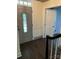 Foyer featuring a decorative front door, hardwood floors, and open view to another room at 4905 Montibello Dr, Charlotte, NC 28226