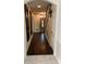 Spacious hallway with hardwood floors leading to the front door and staircase at 4905 Montibello Dr, Charlotte, NC 28226
