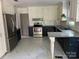 Well-equipped kitchen featuring stainless steel appliances, granite countertops, and ample cabinet space at 4905 Montibello Dr, Charlotte, NC 28226
