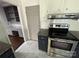 Updated kitchen featuring stainless steel appliances, white cabinetry, and granite countertops at 4905 Montibello Dr, Charlotte, NC 28226