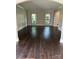 Inviting living room boasts gleaming hardwood floors, elegant trim and sunlit windows for natural light at 4905 Montibello Dr, Charlotte, NC 28226