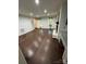 Bright living room highlighting hardwood floors, a cozy fireplace, and custom built-ins at 4905 Montibello Dr, Charlotte, NC 28226