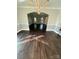 Cozy living room showcasing hardwood floors, modern trim and an arched doorway to a connected room at 4905 Montibello Dr, Charlotte, NC 28226
