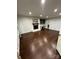 Spacious living room offering hardwood floors, a cozy fireplace, and custom built-ins at 4905 Montibello Dr, Charlotte, NC 28226