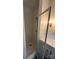 The bathroom features a glass enclosed tiled shower area with elegant fixtures and a decorative wall sconce at 4905 Montibello Dr, Charlotte, NC 28226