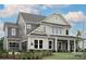 Beautiful two-story home showcasing a modern design and complemented by lush landscaping in a suburban neighborhood at 504 Meadow Ridge Dr, Belmont, NC 28012