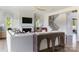 Bright living room with a fireplace, modern staircase, and decorative console table at 504 Meadow Ridge Dr, Belmont, NC 28012