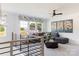 Bright living room boasts large windows, stylish decor, and comfortable seating at 504 Meadow Ridge Dr, Belmont, NC 28012