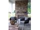 Inviting outdoor fireplace on the patio with stylish seating and a stone surround, perfect for entertaining at 504 Meadow Ridge Dr, Belmont, NC 28012