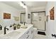 Bright bathroom with double vanity, modern fixtures, and a glass-enclosed shower at 5052 Elm View Dr # 16, Charlotte, NC 28277