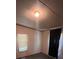 This is a bedroom with a small window and off-white walls at 515 Willow St, Lincolnton, NC 28092