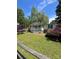 Charming single-story home with a cozy front porch, lush lawn, and vibrant landscaping at 515 Willow St, Lincolnton, NC 28092