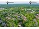 An aerial view of a neighborhood with lush landscaping near dining and shopping at 5603 Ballinard Ln, Charlotte, NC 28277