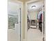 En suite bathroom featuring tiled shower, and a walk-in closet with organized storage for shoes and clothes at 5603 Ballinard Ln, Charlotte, NC 28277