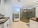 Bathroom with tiled shower, elegant vanity, and neutral colors at 5603 Ballinard Ln, Charlotte, NC 28277