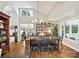 Bright dining room with a chandelier, hardwood floors, and an open layout at 5603 Ballinard Ln, Charlotte, NC 28277