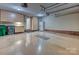 Spacious garage features built-in cabinets, a refrigerator, and ample storage space at 5603 Ballinard Ln, Charlotte, NC 28277