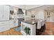 A spacious kitchen with stainless steel appliances, marble backsplash, and center island with seating at 5603 Ballinard Ln, Charlotte, NC 28277