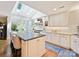 Modern kitchen with stainless steel appliances, skylights, and an island with seating at 5603 Ballinard Ln, Charlotte, NC 28277