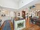 Open-concept kitchen with an island, stainless appliances, and hardwood floors at 5603 Ballinard Ln, Charlotte, NC 28277