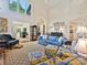 Spacious living area with large windows, high ceilings, and comfortable seating at 5603 Ballinard Ln, Charlotte, NC 28277