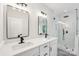 Bright bathroom boasts double vanity sinks, modern fixtures, and a walk-in shower with glass enclosure at 5745 Snapdragon Ln, Huntersville, NC 28078