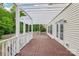 Spacious wooden deck with white pergola and railings, perfect for outdoor living and enjoyment at 5745 Snapdragon Ln, Huntersville, NC 28078