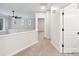 Hallway featuring carpeted floors, a ceiling fan, and a doorway leading to another room at 5745 Snapdragon Ln, Huntersville, NC 28078
