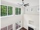 Bright living room featuring a fireplace, hardwood floors and large windows with natural light at 5745 Snapdragon Ln, Huntersville, NC 28078