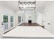 Open floor plan with a spacious living room, a fireplace, and glass doors leading to the outdoor space at 5745 Snapdragon Ln, Huntersville, NC 28078