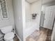 Bathroom with a tub, toilet, and separate walk-in shower at 6231 Kentwood Dr, Kannapolis, NC 28081