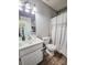 Bathroom featuring a modern toilet, vanity, and shower with sliding glass doors at 6231 Kentwood Dr, Kannapolis, NC 28081